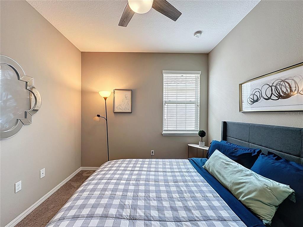 201 Silver Maple Road Groveland, FL 34736 - Photo 39 of 89 a bedroom with a bed and a window