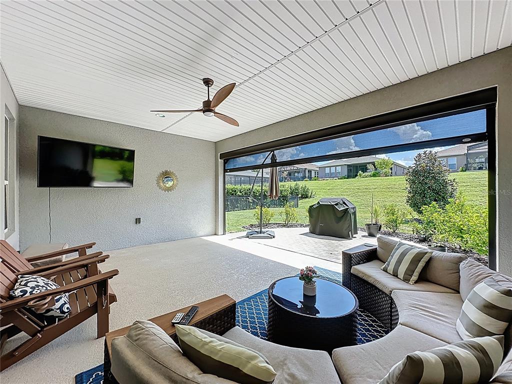 201 Silver Maple Road Groveland, FL 34736 - Photo 52 of 89 a living room with furniture and a flat screen tv