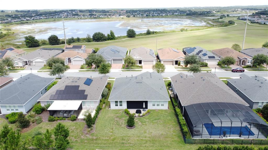 201 Silver Maple Road Groveland, FL 34736 - Photo 60 of 89 an aerial view of a house with outdoor space and lake view