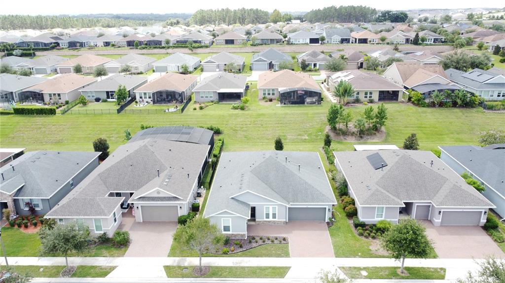 201 Silver Maple Road Groveland, FL 34736 - Photo 62 of 89 an aerial view of a house with outdoor space and lake view
