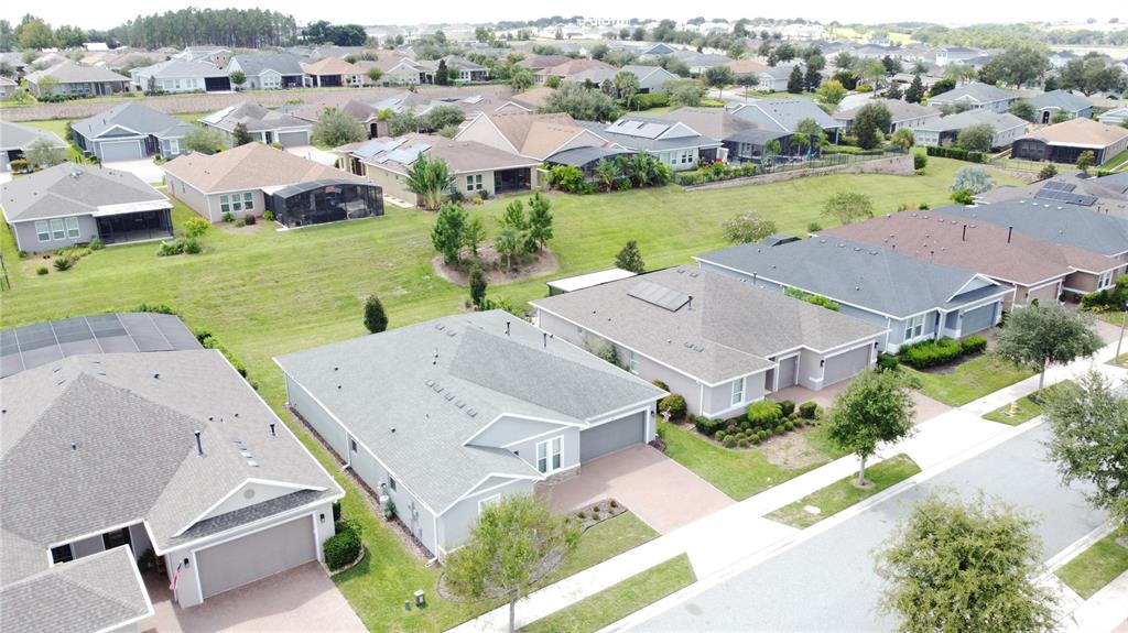 201 Silver Maple Road Groveland, FL 34736 - Photo 63 of 89 an aerial view of residential houses with outdoor space and river