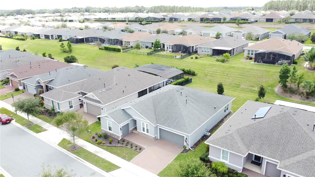 201 Silver Maple Road Groveland, FL 34736 - Photo 64 of 89 an aerial view of a house with outdoor space and lake view