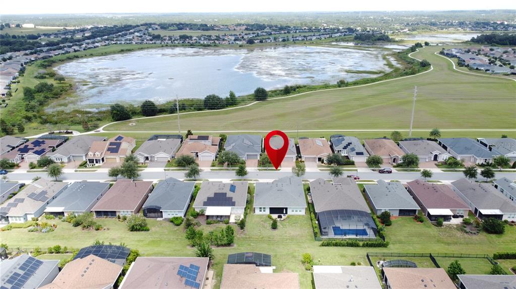 201 Silver Maple Road Groveland, FL 34736 - Photo 67 of 89 an aerial view of residential houses with outdoor space and swimming pool