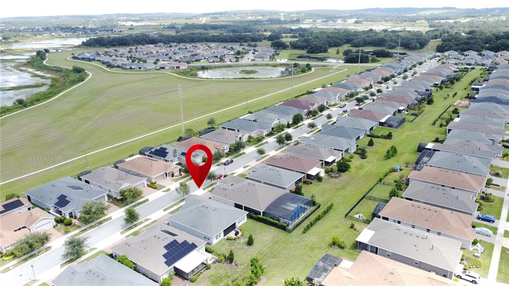 201 Silver Maple Road Groveland, FL 34736 - Photo 69 of 89 an aerial view of ocean and residential houses with outdoor space