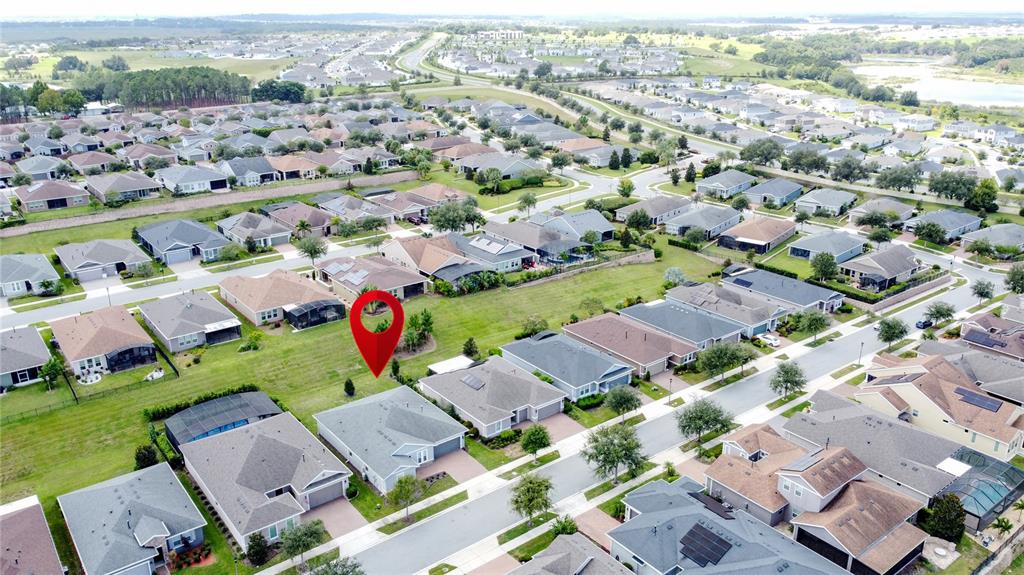 201 Silver Maple Road Groveland, FL 34736 - Photo 70 of 89 an aerial view of a city with lots of residential buildings