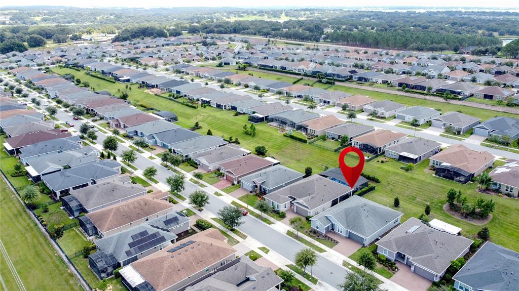 201 Silver Maple Road Groveland, FL 34736 - Photo 72 of 89 an aerial view of a city with lots of residential buildings