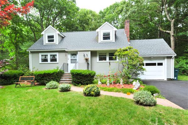 474 Dutton Road Sudbury, MA 01776 - Photo 1 of 17 a front view of a house with a yard and garage