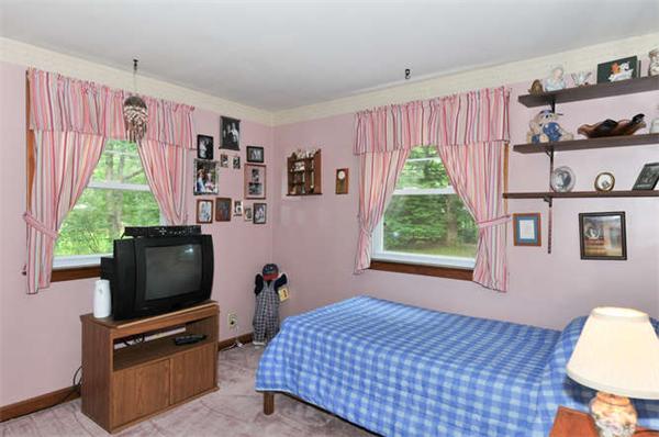 474 Dutton Road Sudbury, MA 01776 - Photo 8 of 17 a living room with furniture and a flat screen tv