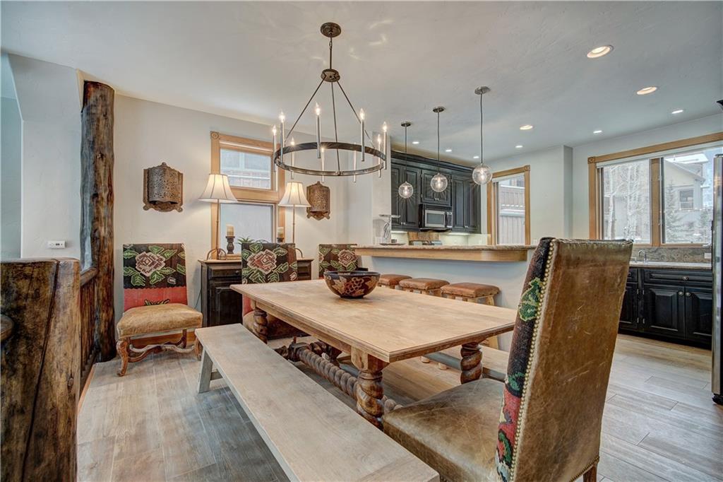 72 River Run Road Keystone, CO 80435 - Photo 13 of 35 a view of a dining room with furniture window and wooden floor