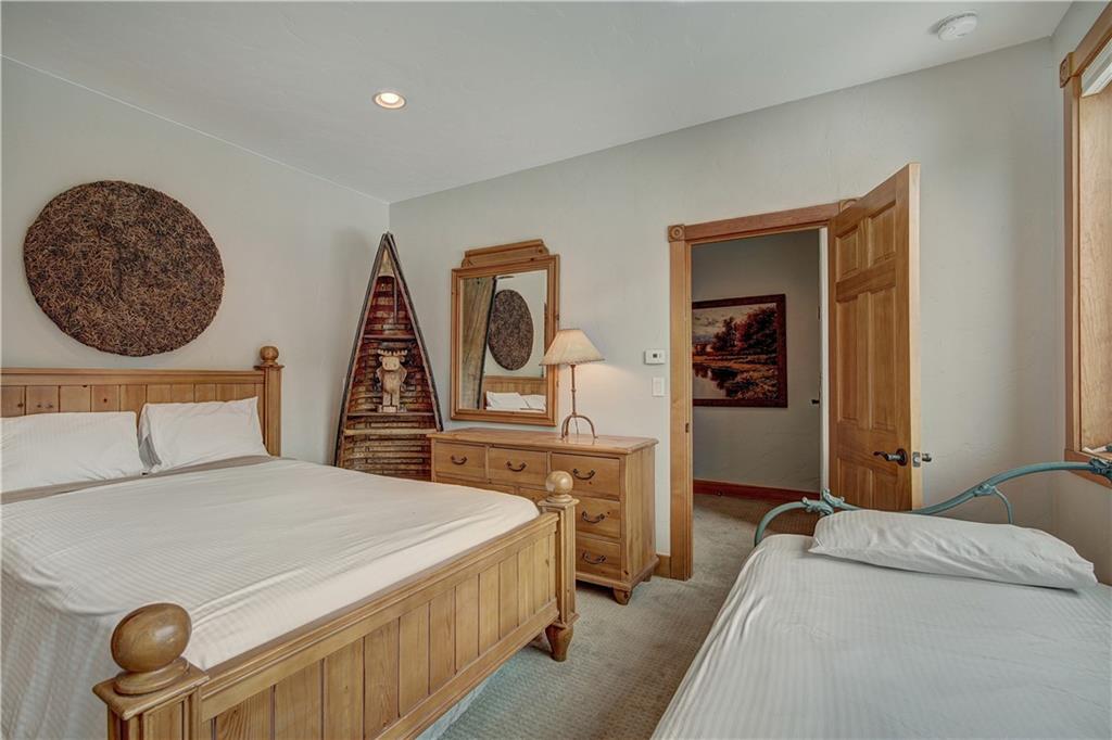 72 River Run Road Keystone, CO 80435 - Photo 19 of 35 a bedroom with a bed and a dresser
