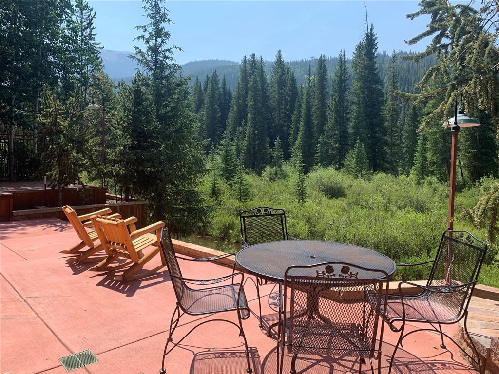 72 River Run Road Keystone, CO 80435 - Photo 3 of 35 a backyard of a house with yard table and chairs