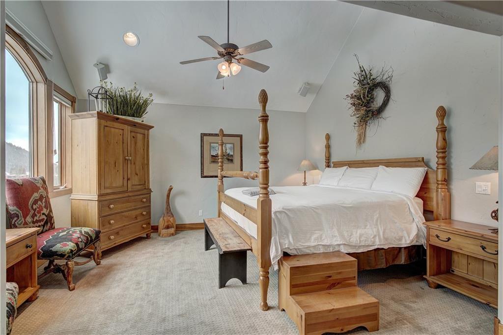 72 River Run Road Keystone, CO 80435 - Photo 27 of 35 a bed room with a bed and a chair