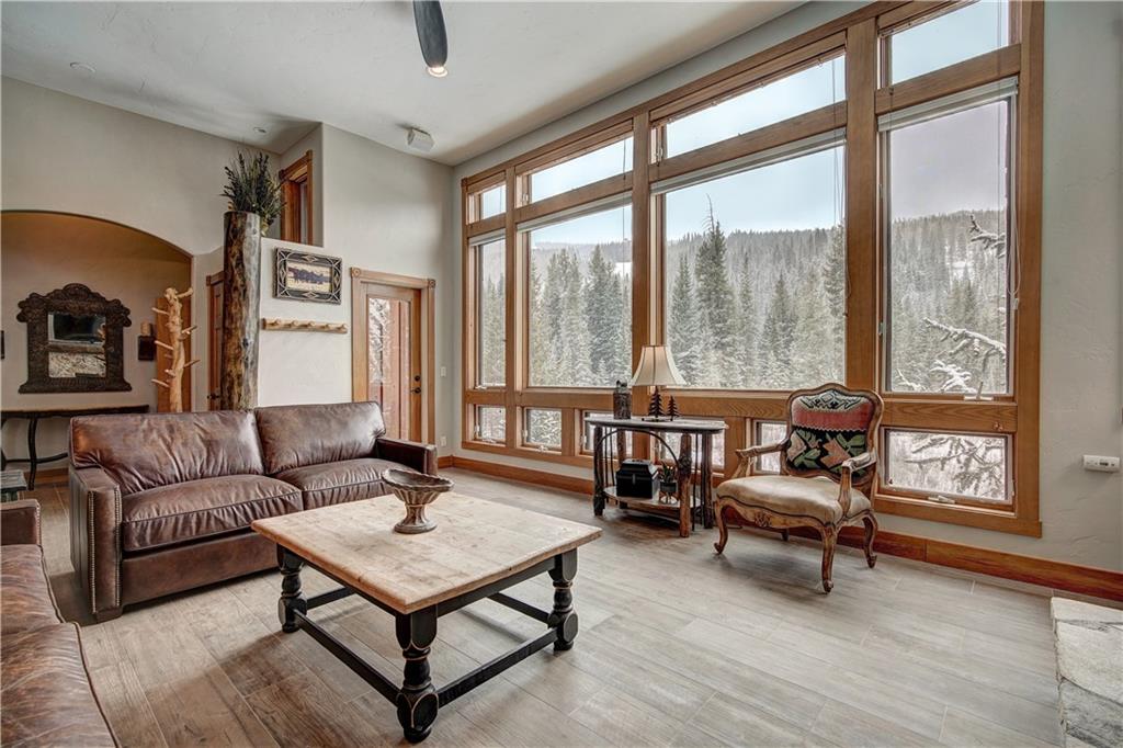 72 River Run Road Keystone, CO 80435 - Photo 4 of 35 a living room with furniture and a floor to ceiling window