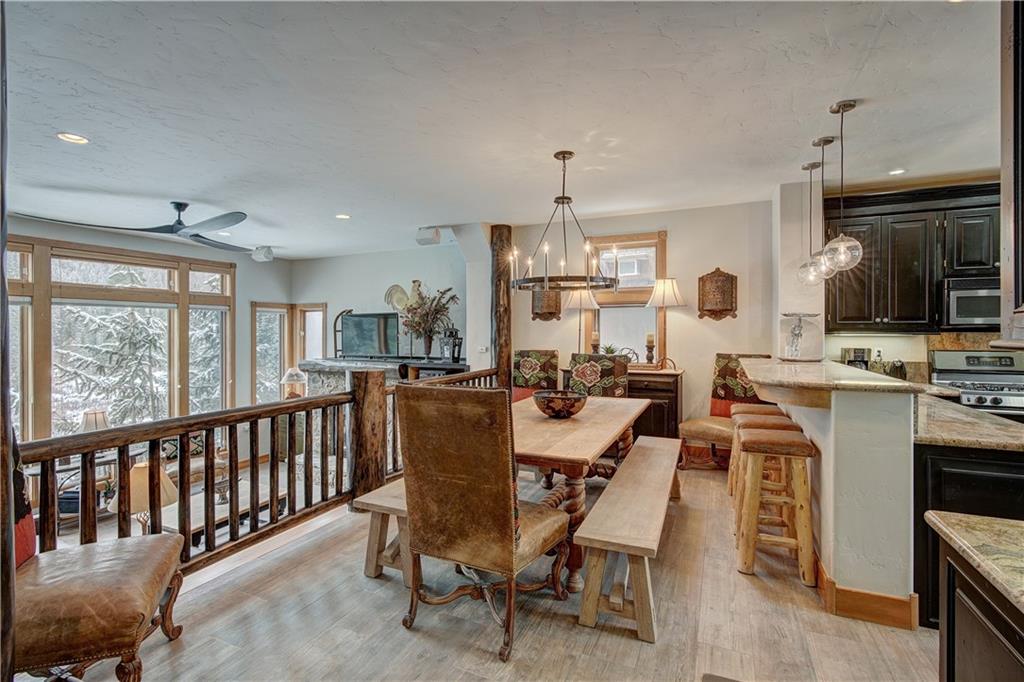 72 River Run Road Keystone, CO 80435 - Photo 9 of 35 a large kitchen with a table and chairs in it