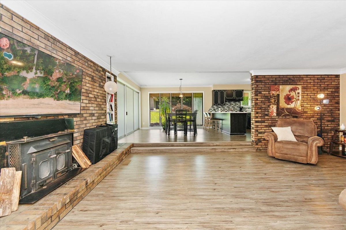 19 Horseshoe Bend Road Leoma, TN 38468 - Photo 11 of 29 a view of a living room and kitchen with furniture wooden floor and windows