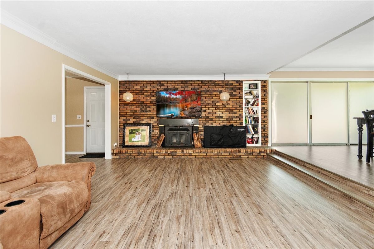 19 Horseshoe Bend Road Leoma, TN 38468 - Photo 12 of 29 wooden floor in an empty room with a fireplace