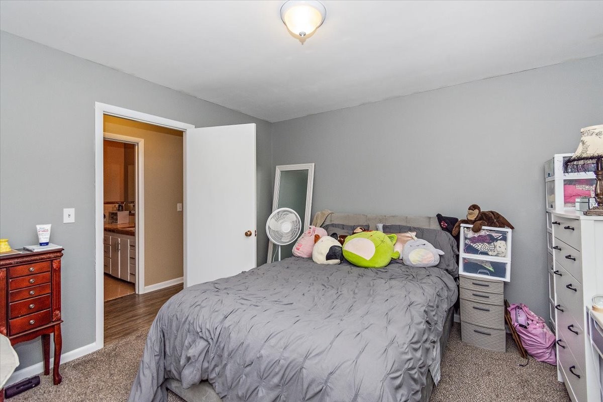 19 Horseshoe Bend Road Leoma, TN 38468 - Photo 15 of 29 a bedroom with a bed and a lamp on dresser