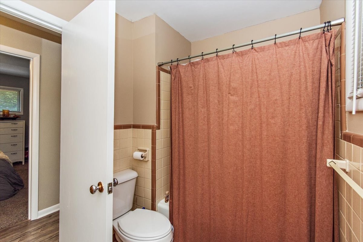 19 Horseshoe Bend Road Leoma, TN 38468 - Photo 17 of 29 a white toilet sitting next to a shower curtain