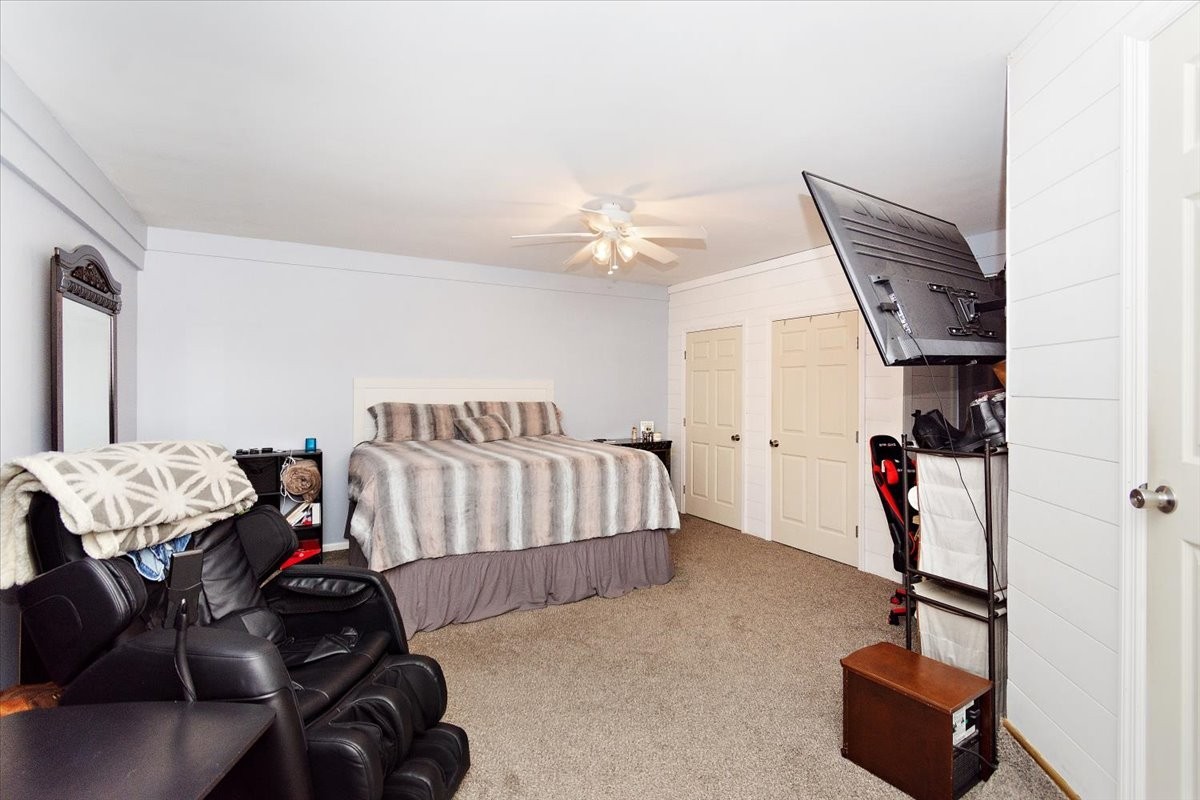 19 Horseshoe Bend Road Leoma, TN 38468 - Photo 20 of 29 a bedroom with furniture and a chandelier