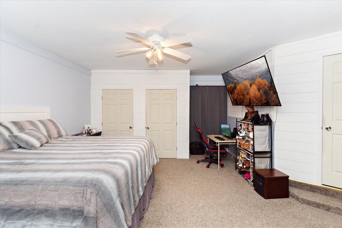 19 Horseshoe Bend Road Leoma, TN 38468 - Photo 21 of 29 a bedroom with a bed and a chandelier