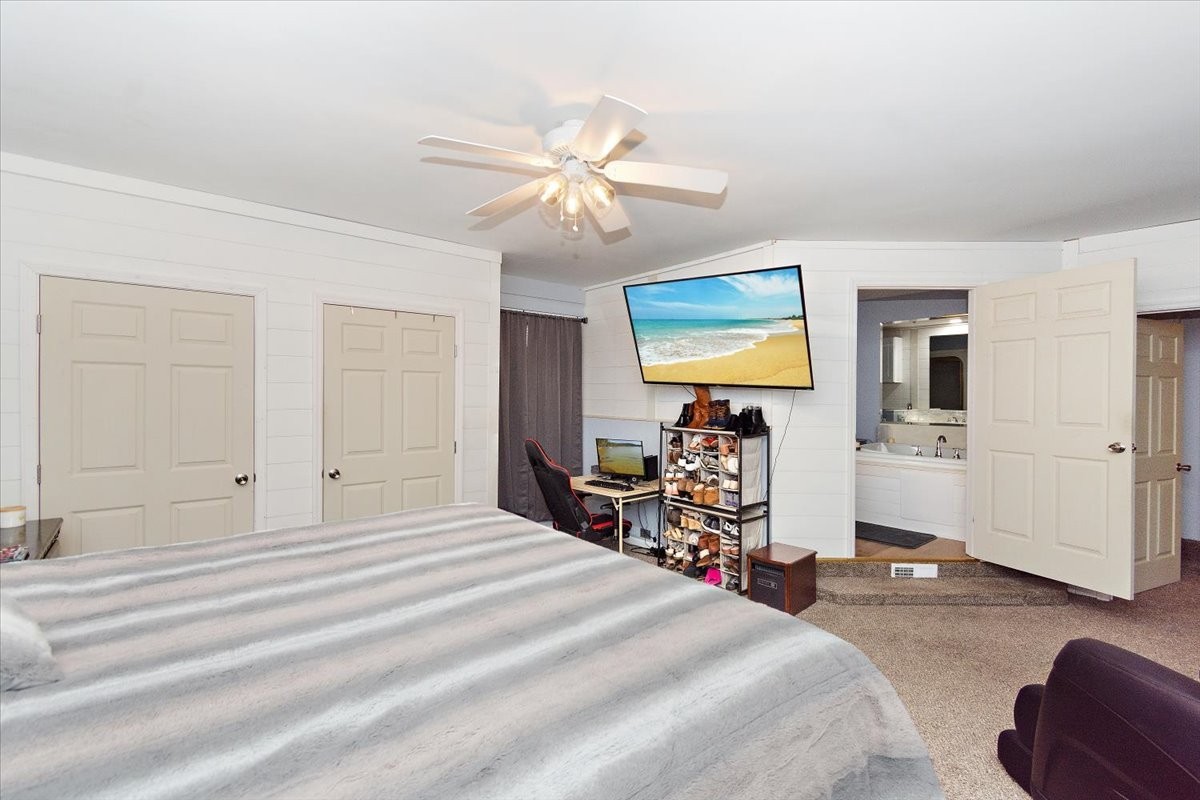 19 Horseshoe Bend Road Leoma, TN 38468 - Photo 22 of 29 a bedroom with a bed and wooden floor