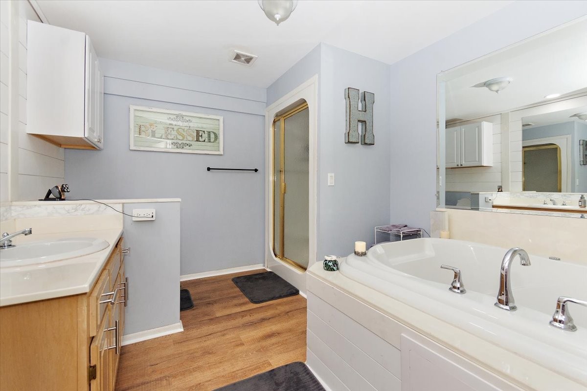 19 Horseshoe Bend Road Leoma, TN 38468 - Photo 23 of 29 a bathroom with a tub sink and mirror