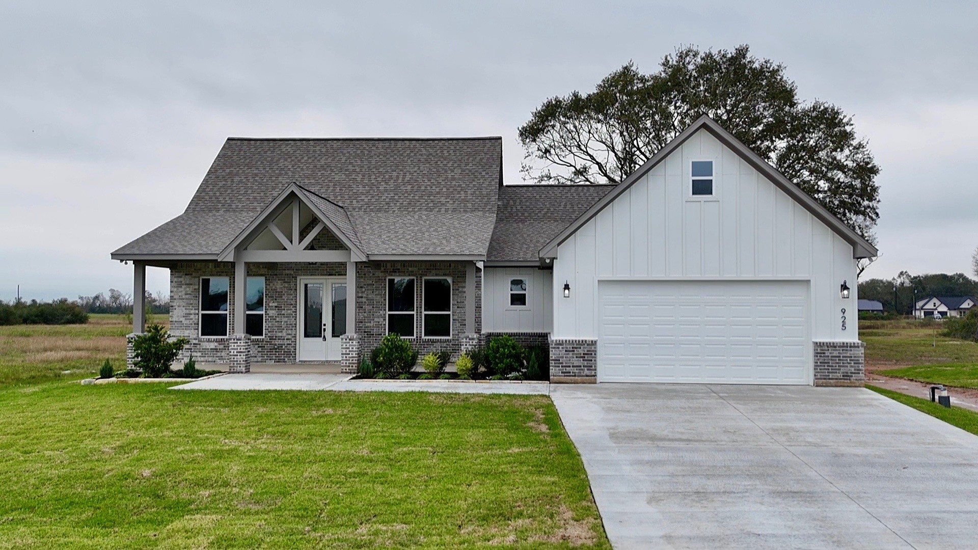 925 Buffalo Trail Angleton, TX 77515 - Photo 2 of 19 a front view of a house with a yard