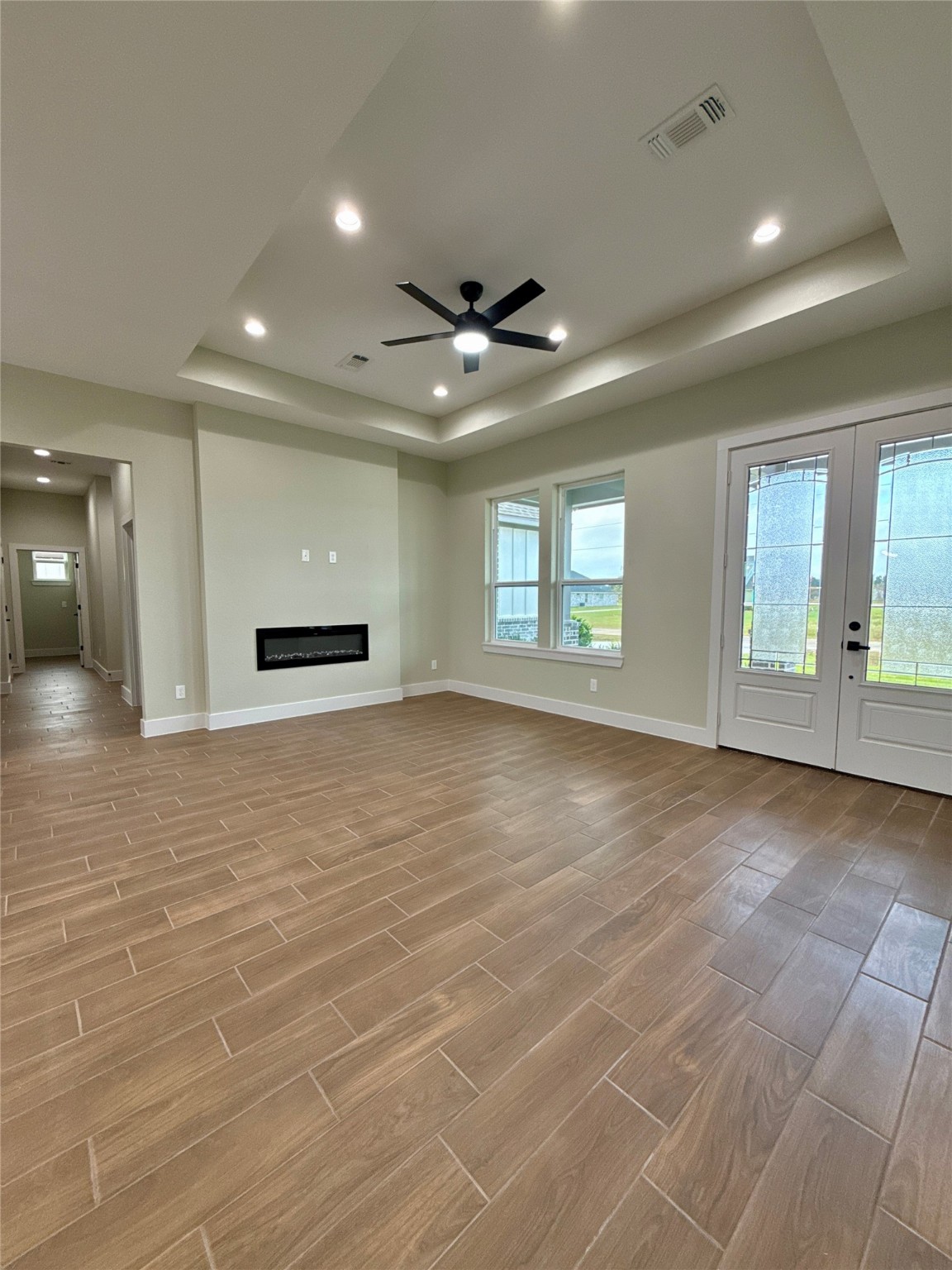 925 Buffalo Trail Angleton, TX 77515 - Photo 5 of 19 an empty room with wooden floor and windows