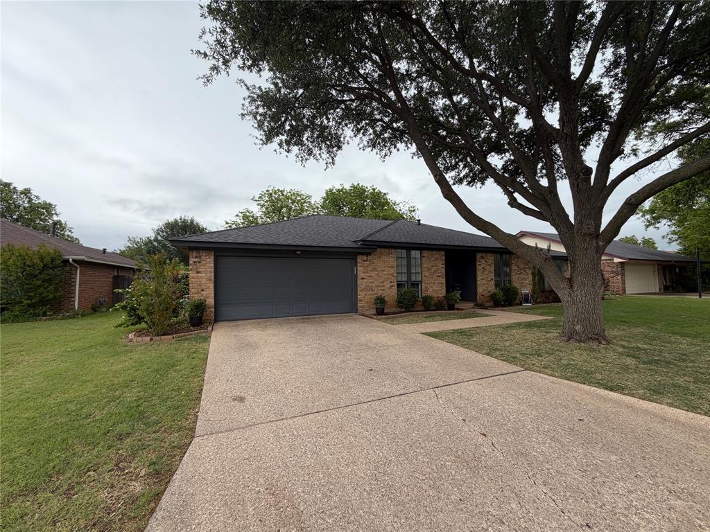 925 Manciples Way Abilene, TX 79602 - Photo 2 of 30 a front view of a house with a yard and trees