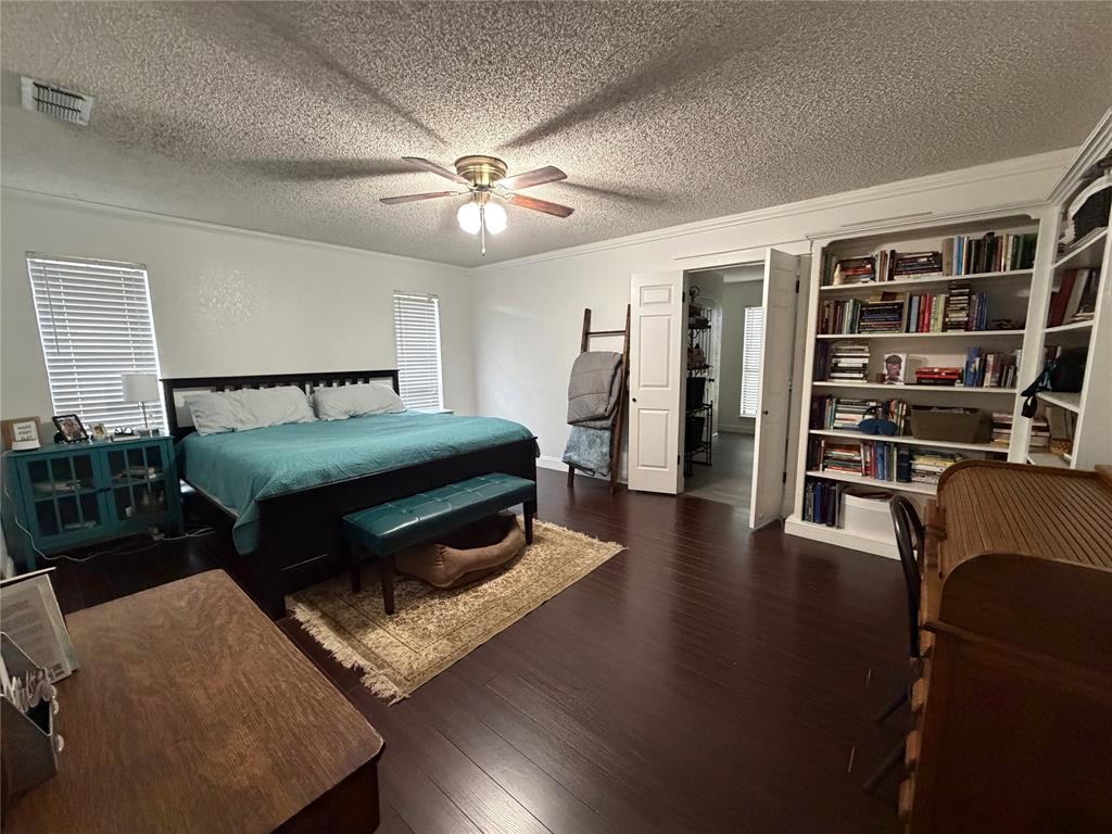 925 Manciples Way Abilene, TX 79602 - Photo 22 of 30 a bedroom with furniture and a chandelier