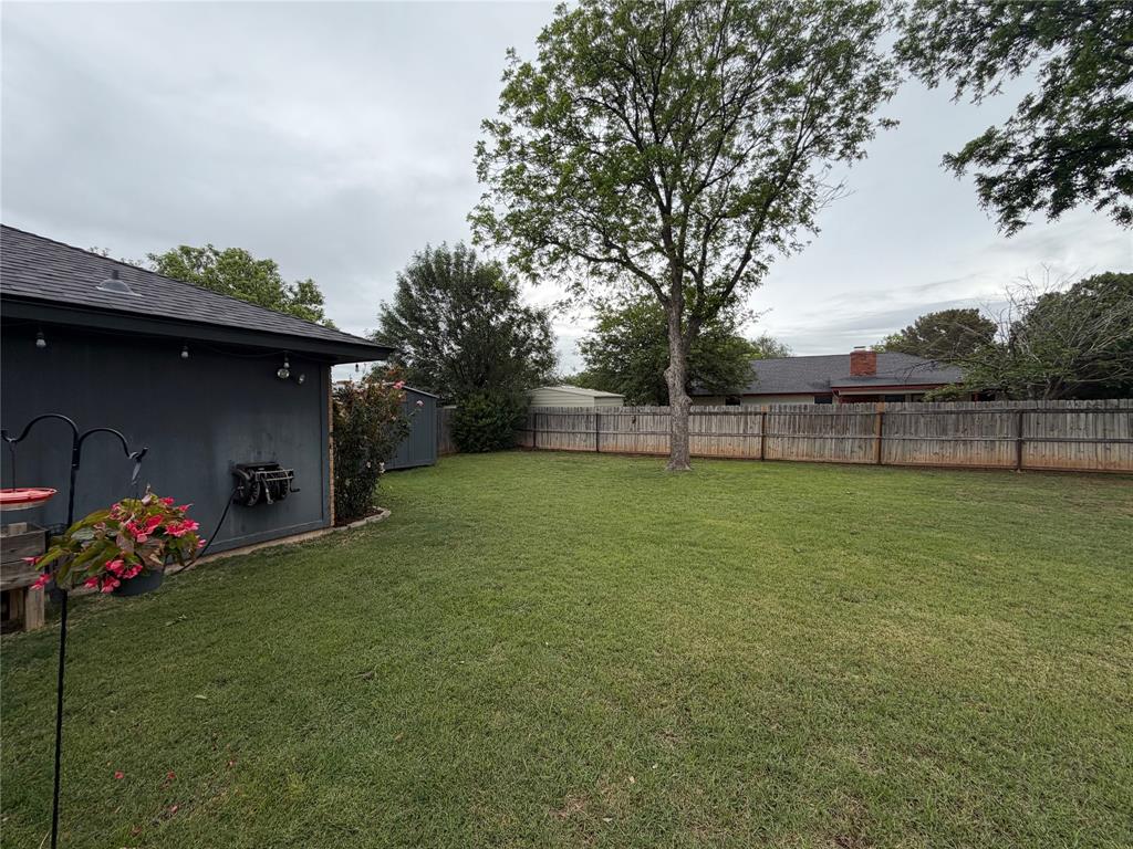 925 Manciples Way Abilene, TX 79602 - Photo 28 of 30 a view of a garden with a bench