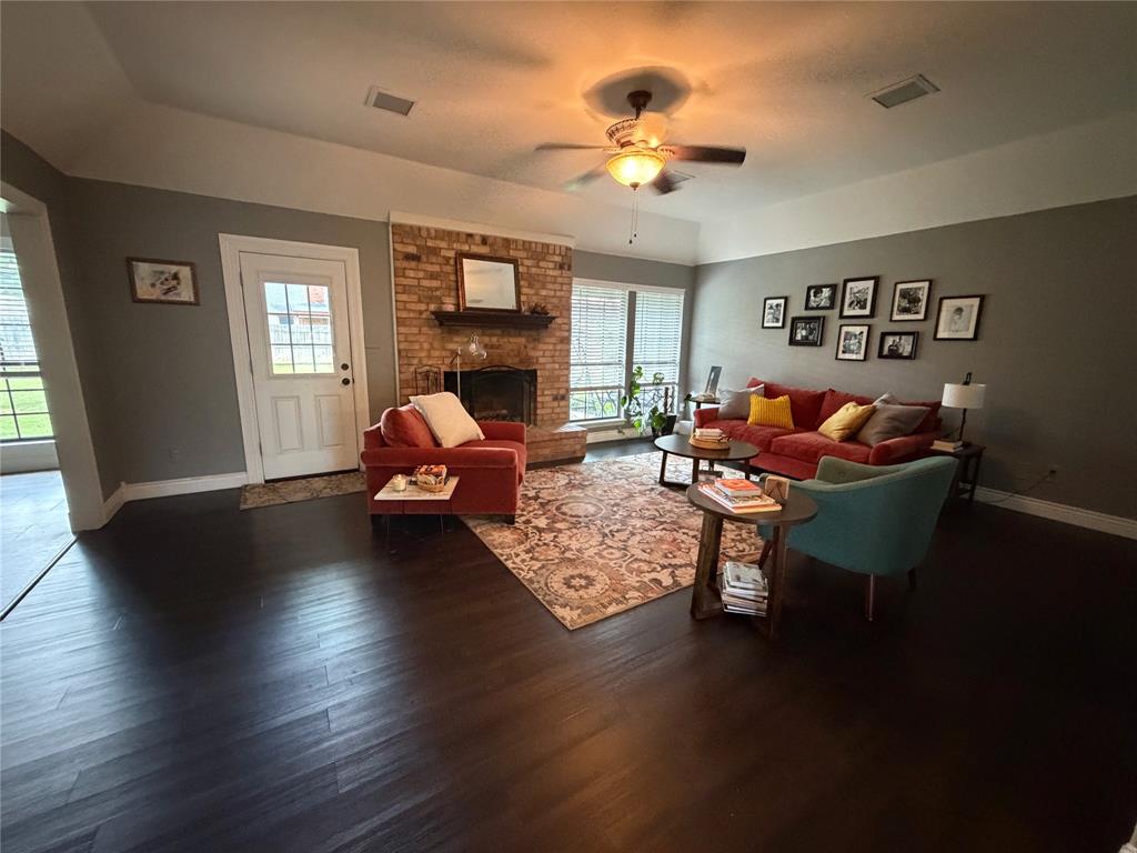 925 Manciples Way Abilene, TX 79602 - Photo 8 of 30 a living room with furniture and a chandelier