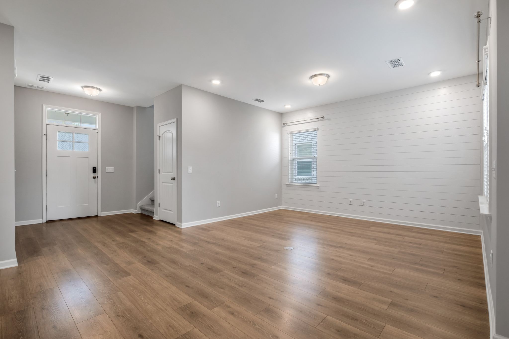 3721 Hoggett Ford Road Hermitage, TN 37076 - Photo 12 of 33 a view of an empty room with wooden floor and a window