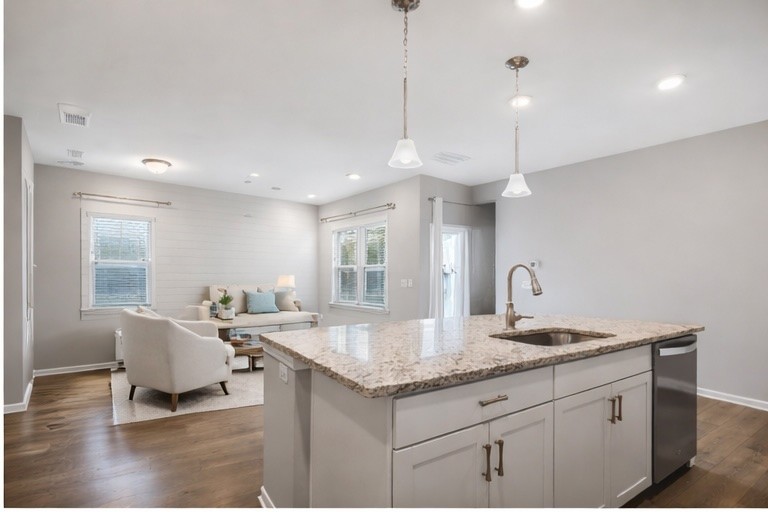 3721 Hoggett Ford Road Hermitage, TN 37076 - Photo 16 of 33 a living room with granite countertop kitchen island furniture and a chandelier