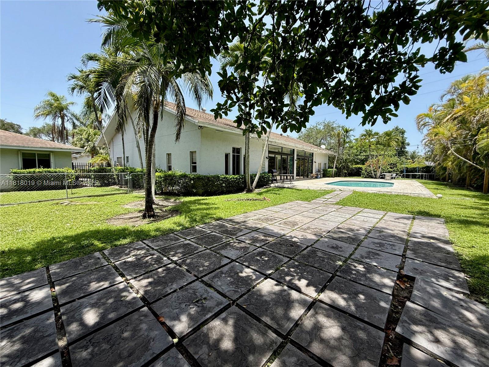 8200 Southwest 92nd Street Miami, FL 33156 - Photo 11 of 21 a front view of a house with garden