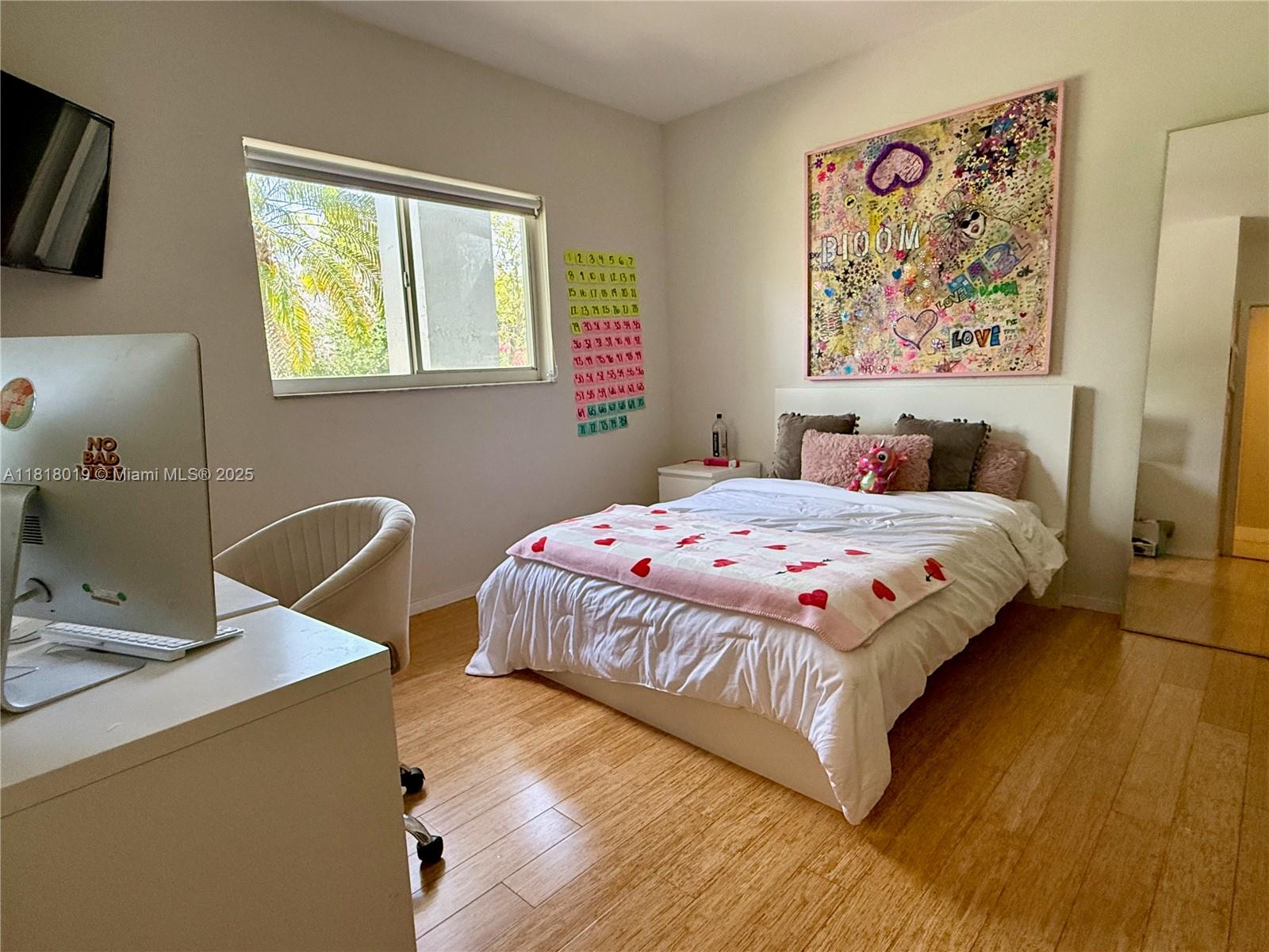 8200 Southwest 92nd Street Miami, FL 33156 - Photo 14 of 21 a bedroom with a bed and a table in it