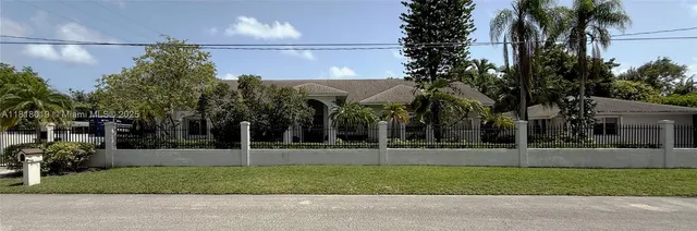 an aerial view of a house with outdoor space