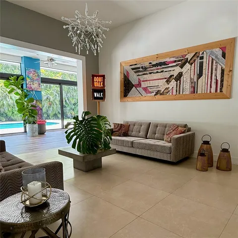 a living room with furniture and flowers