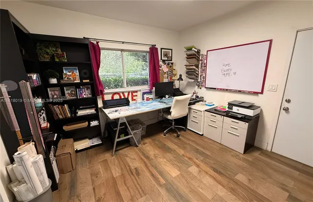 a room with furniture a rug and a window