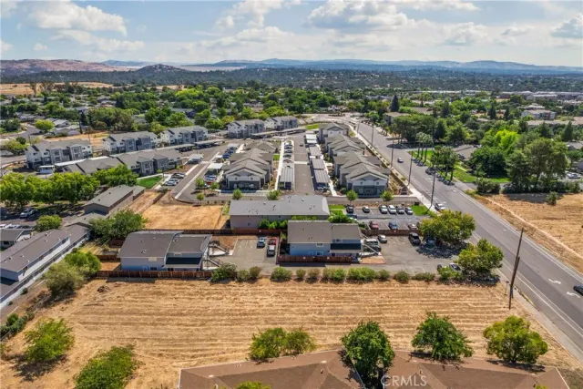 an aerial view of a house with a yard and plants