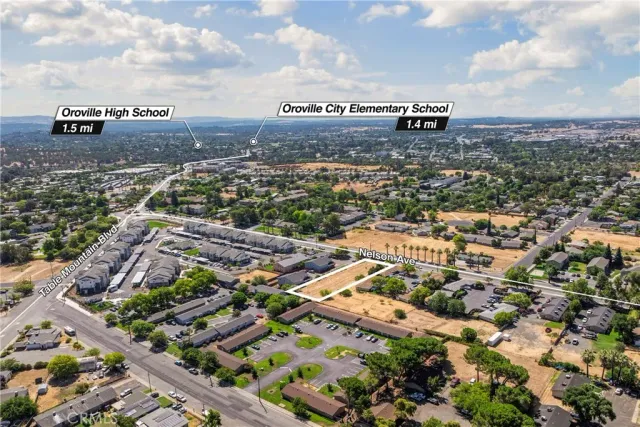 an aerial view of residential building and car parked