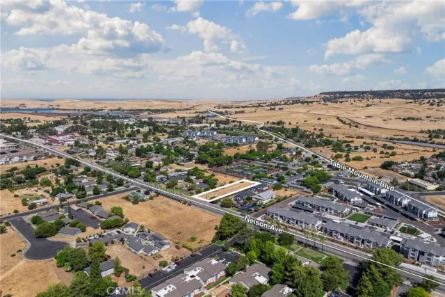 an aerial view of residential building and car parked