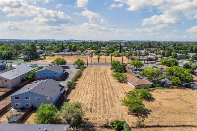 an aerial view of a house with lake view and mountain view in back