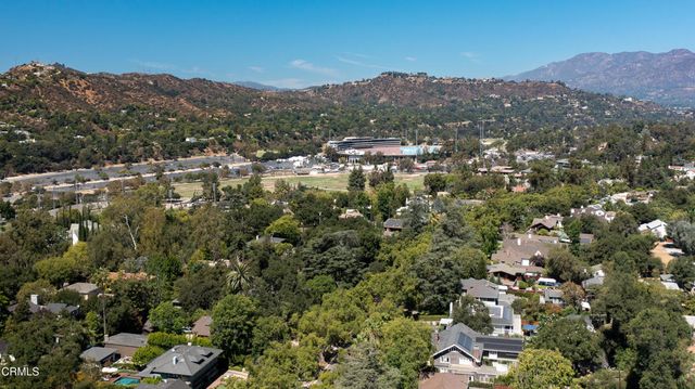 an aerial view of residential house and green space