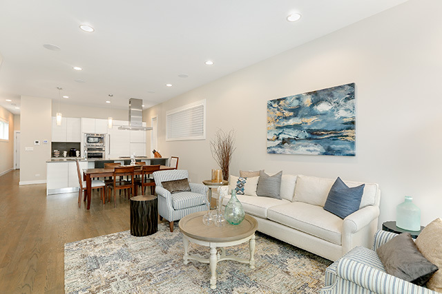 2042 West Rice Street, Unit 1 Chicago, IL 60622 - Photo 2 of 27 a living room with furniture kitchen view and a dining table