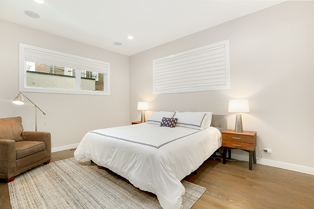 2042 West Rice Street, Unit 1 Chicago, IL 60622 - Photo 13 of 27 a bedroom with a bed and a couch