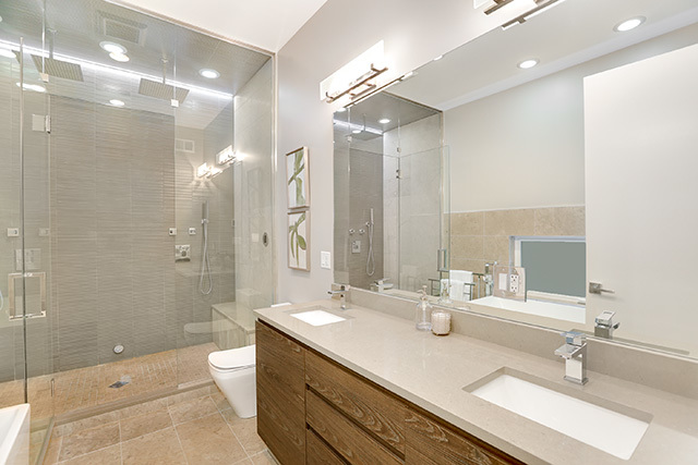 2042 West Rice Street, Unit 1 Chicago, IL 60622 - Photo 15 of 27 a bathroom with a double vanity sink mirror double and shower