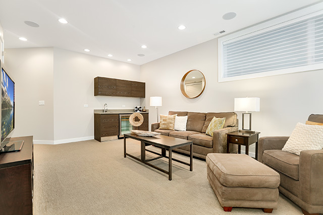 2042 West Rice Street, Unit 1 Chicago, IL 60622 - Photo 18 of 27 a living room with furniture a fireplace and a window
