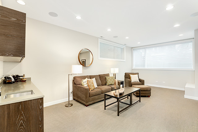 2042 West Rice Street, Unit 1 Chicago, IL 60622 - Photo 20 of 27 a living room with furniture and a flat screen tv