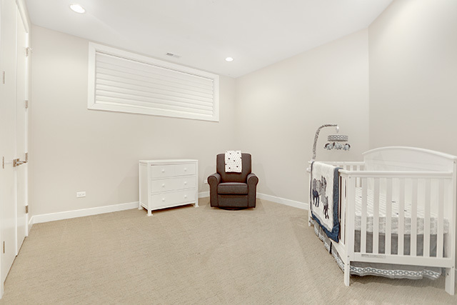 2042 West Rice Street, Unit 1 Chicago, IL 60622 - Photo 23 of 27 a bedroom with furniture and a window